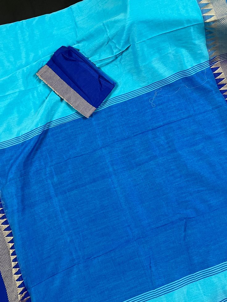 Beautiful Handloom Saree different shades of Ocean Colors (Blue) with Temple Borders with Muted Zari Weave. Saree in Pure Khaadi Handloom Cotton. Item : SareeColor : BlueBase Fabric : Pure Khaadi Handloom Cotton. Blouse piece : Comes with un-stitched Blouse piece.Blouse material : Pure Khaadi Handloom Cotton. Work : Handloom SareeFall & Edging : Comes with Fall and edging (Pico) done and Tassels attached Disclaimer -:- Color variation is possible due to various reasons like phone or desktop sett Blue Slub Silk Anarkali Set, Festive Blue Slub Silk Salwar Kameez, Blue Slub Silk Saree Set, Blue Bollywood Style Salwar Kameez In Slub Silk, Blue Festive Slub Silk Traditional Wear, Blue Cotton Silk Pre-draped Saree For Diwali, Blue Raw Silk Sets With Cutdana, Blue Raw Silk Sets With Cutdana Details, Blue Slub Silk Traditional Wear For Festive Occasions