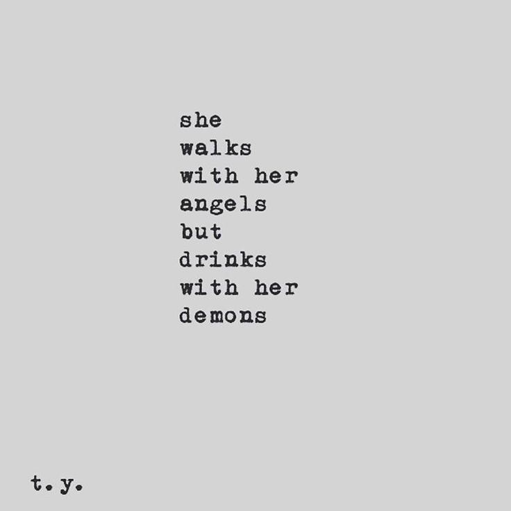 an old typewriter with the words she walks with her angels but drinks with her demons