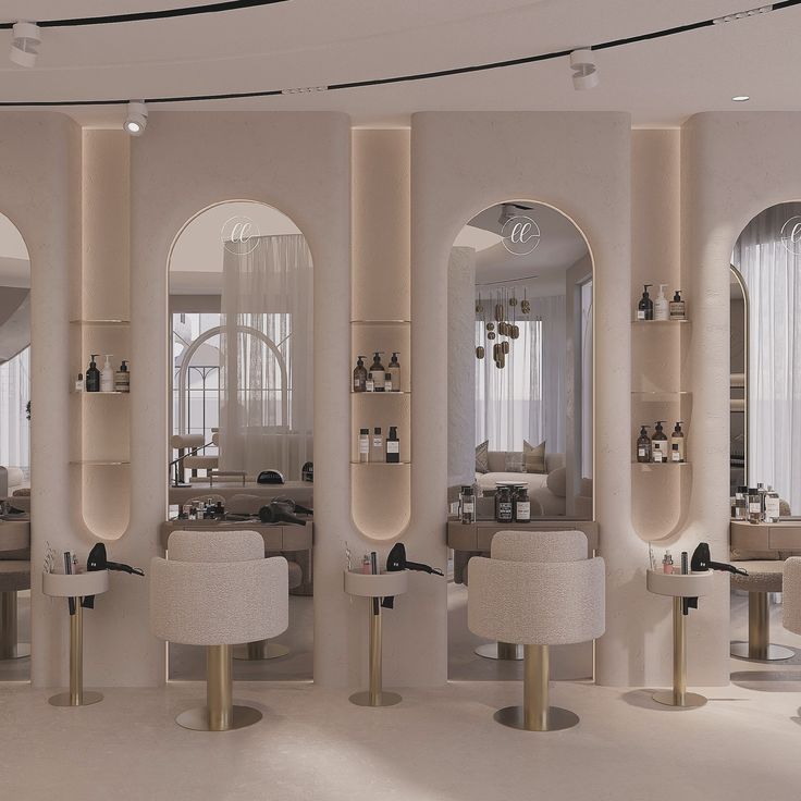 the interior of a modern salon with mirrors and stools