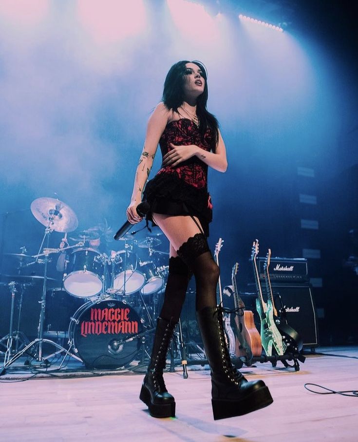 a woman standing on top of a stage