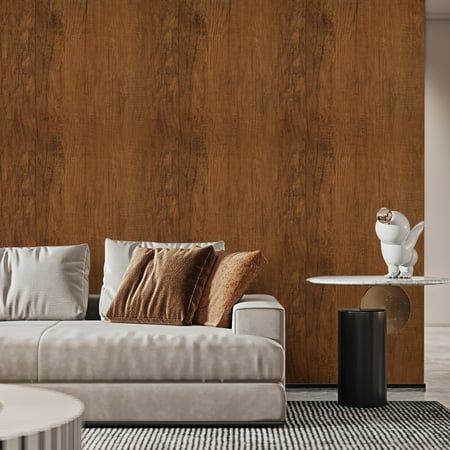 a modern living room with wood paneling and white couches in front of a coffee table