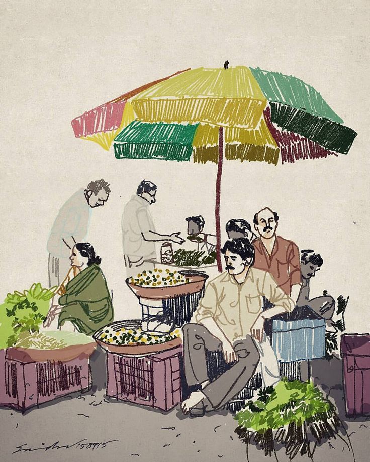 a group of people sitting around a table with an umbrella over them and food on the ground