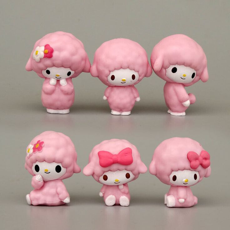 hello kitty figurines are shown in different positions and sizes, including one with a pink bow on her head