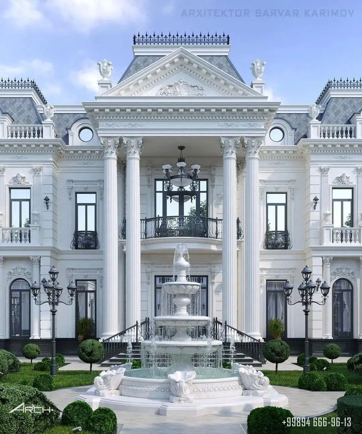 a large white building with a fountain in front of it and lots of windows on the side