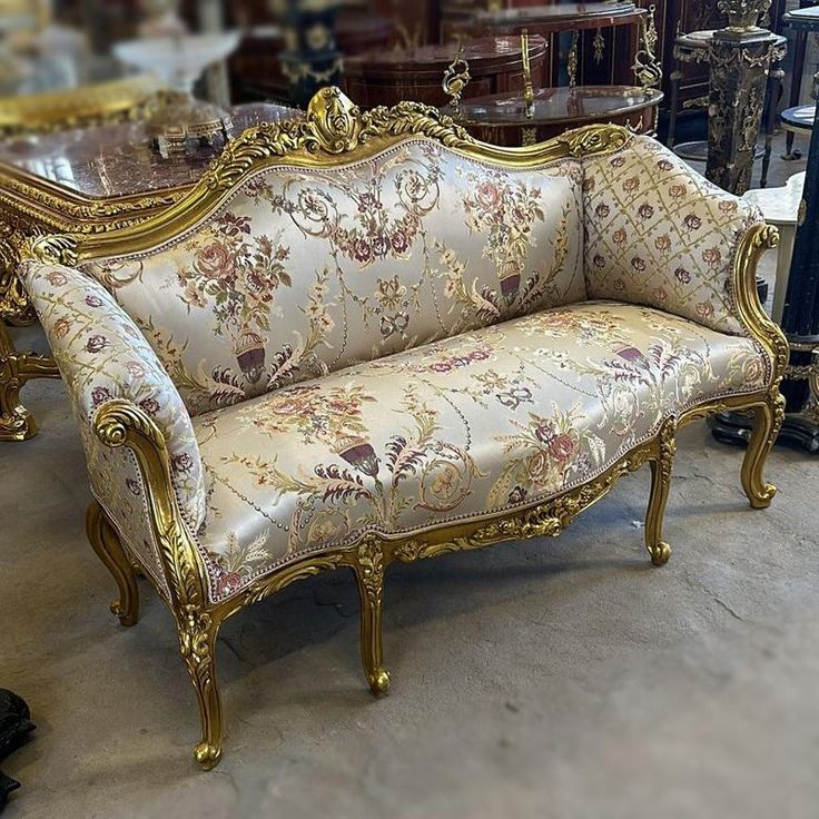 an ornately decorated couch in a store