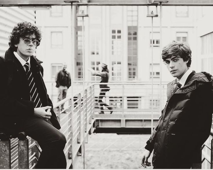 two young men sitting next to each other