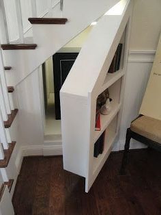 the stairs are white and there is a small dog in it's kennel