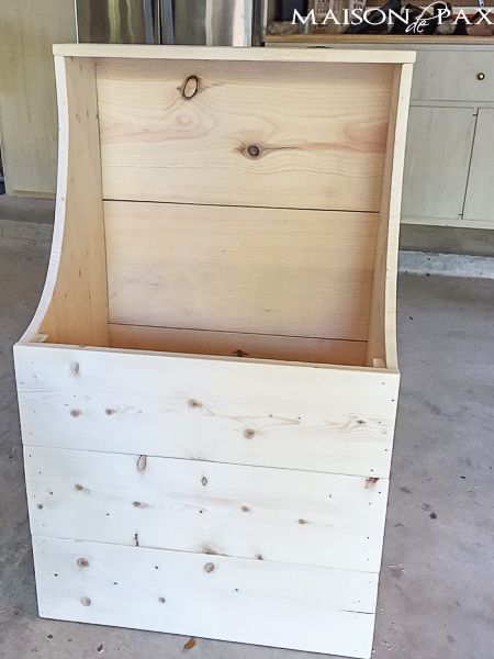 a wooden box sitting on top of a floor