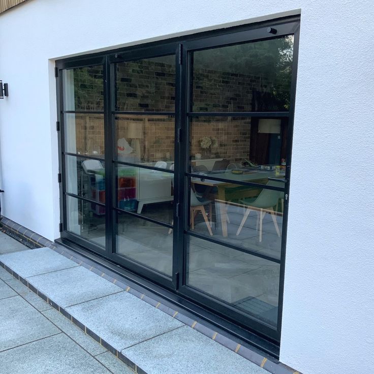 an outside patio area with tables and chairs