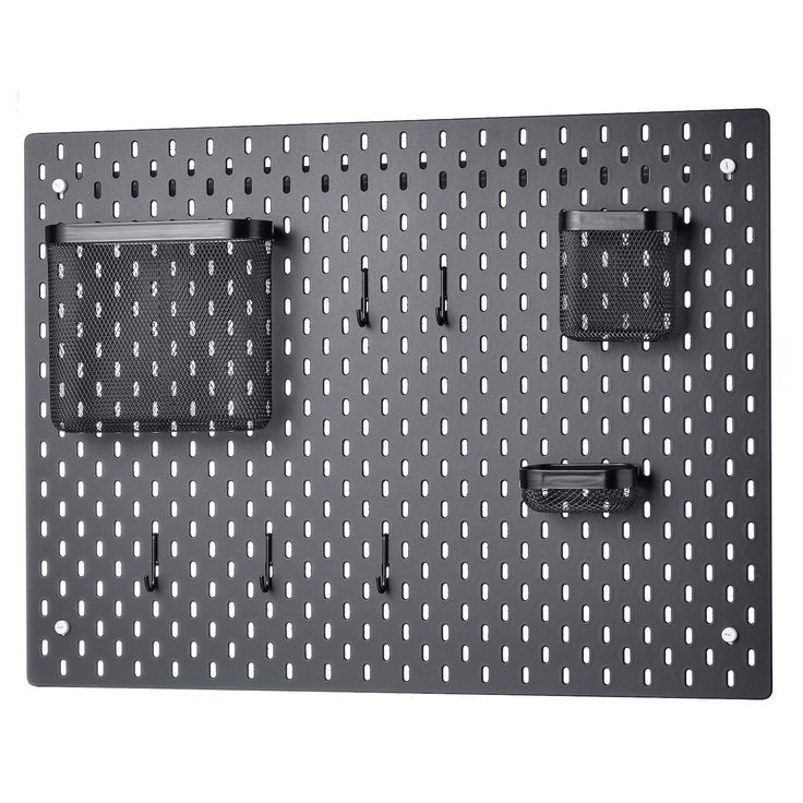 a metal pegboard with two electronic devices mounted on it's sides and one attached to the wall