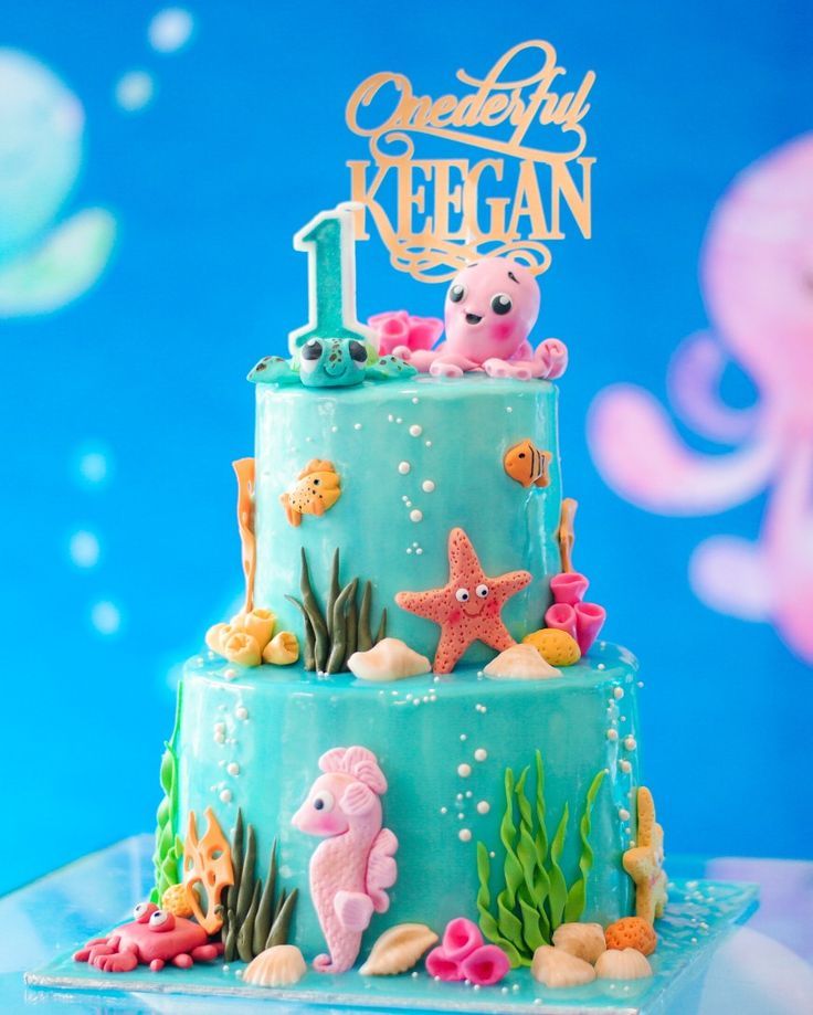 there is a blue cake with sea animals on it