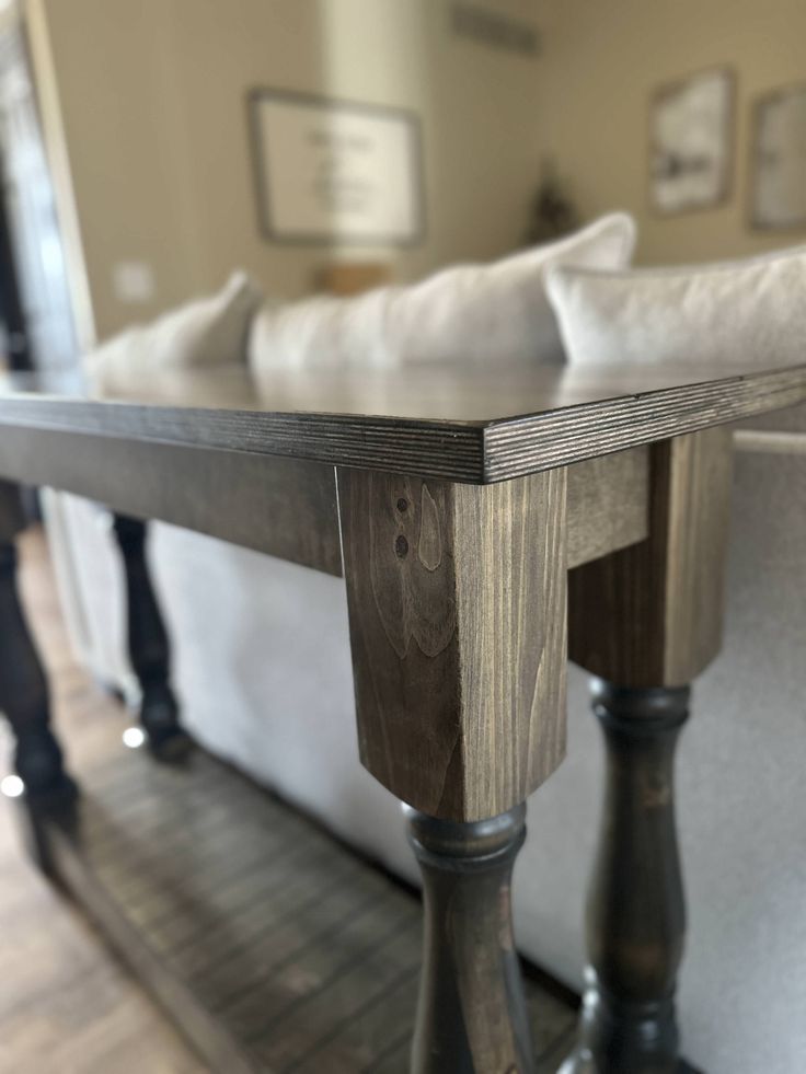 a wooden table sitting in the middle of a living room