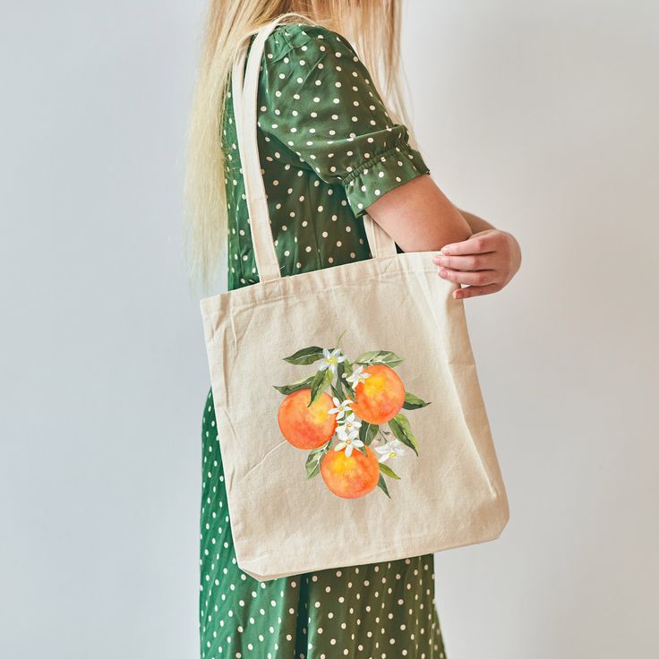 Say hello to your perfect summer tote bag! This adorable orange blossom tote bag brings the best Spring and Summer vibes. Perfect as a gift or for a friend or for yourself. Great for everyday use as a book bag or shopping tote.  This 100% cotton bag comes in one size - 15" x 16"- perfect for everyday wear. While the canvas material will show off your designs in great colors, it's durable and will last for years. The bag features 20" handles (made from the same canvas), making it easy to carry even with a week's worth of shopping. .: 100% cotton canvas .: Available in natural and black colors .: Heavy fabric (12 oz/yd² (406.9 g/m .: Sewn-in label Orange Rectangular Canvas Bag For Summer, Summer Orange Rectangular Canvas Bag, Orange Canvas Bag For Daily Summer Use, Orange Canvas Bag For Daily Use In Summer, Summer Orange Gift Bag, Orange Gift Bag For Summer, Eco-friendly Orange Canvas Bag For Everyday Use, Orange Rectangular Reusable Bags, Orange Canvas Tote Bag For Daily Use