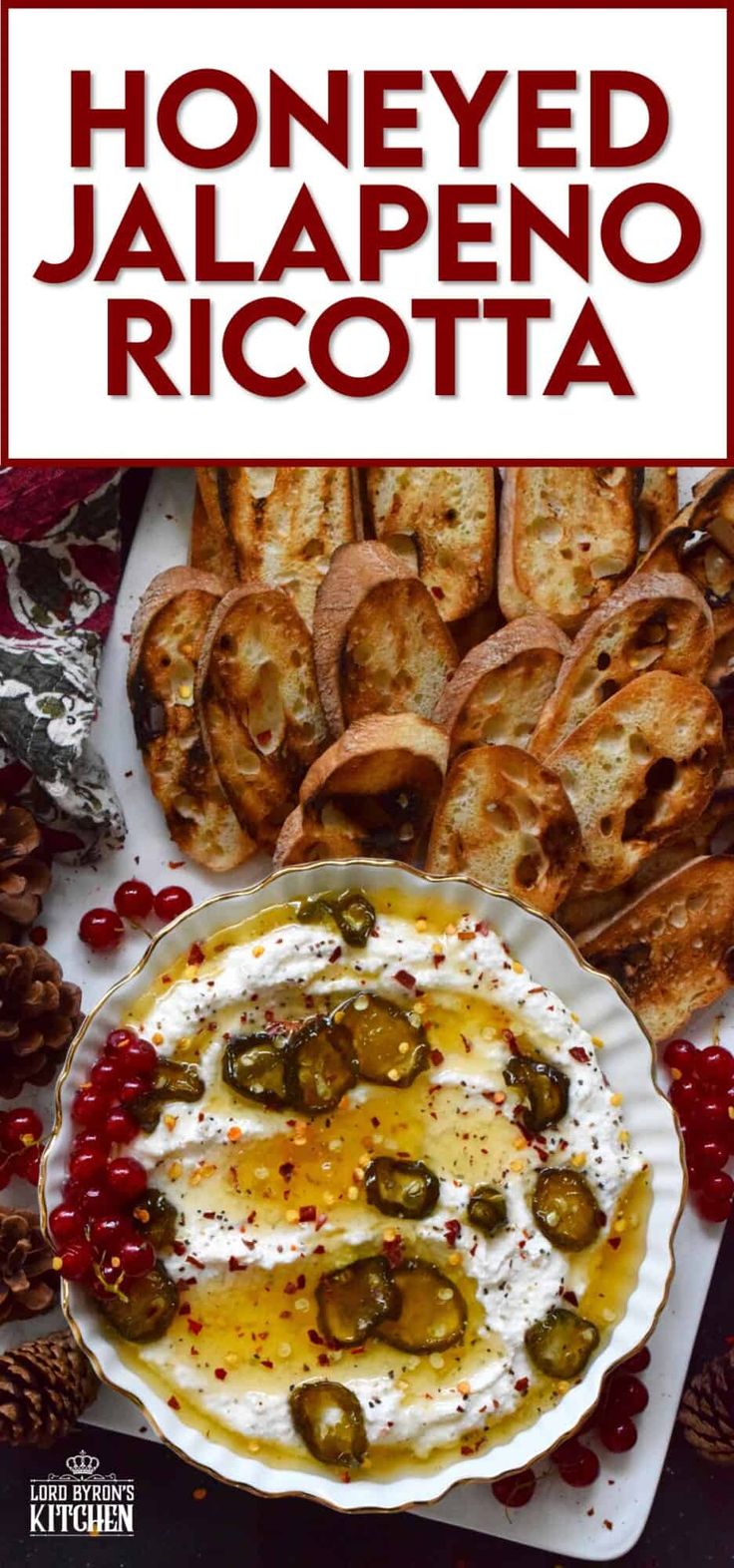 a plate with bread and olives on it next to some other foods that are in the background