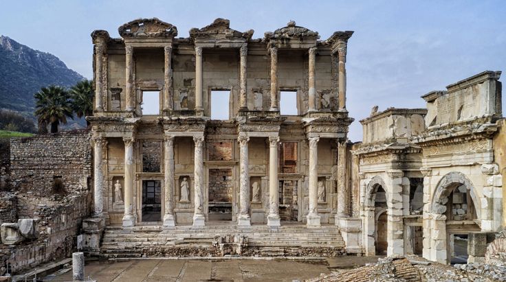 people are standing in front of an old building