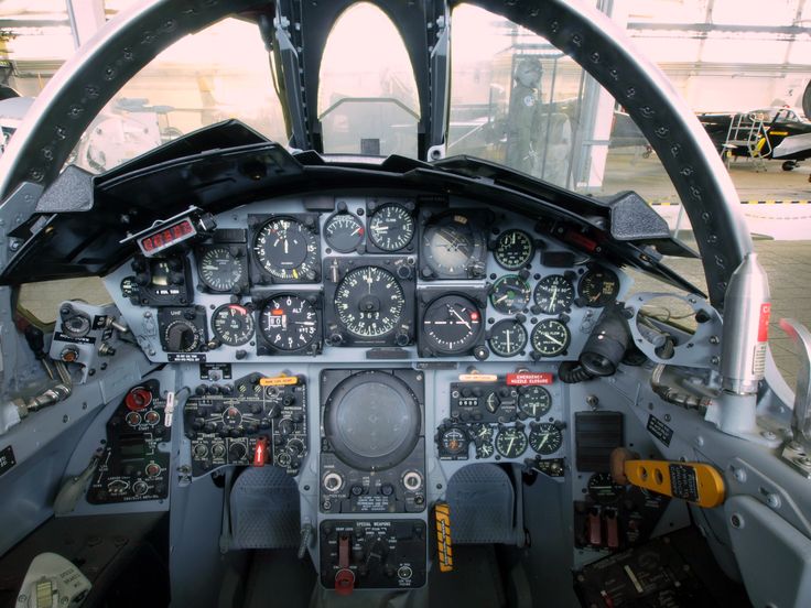 the cockpit of an airplane with many instruments