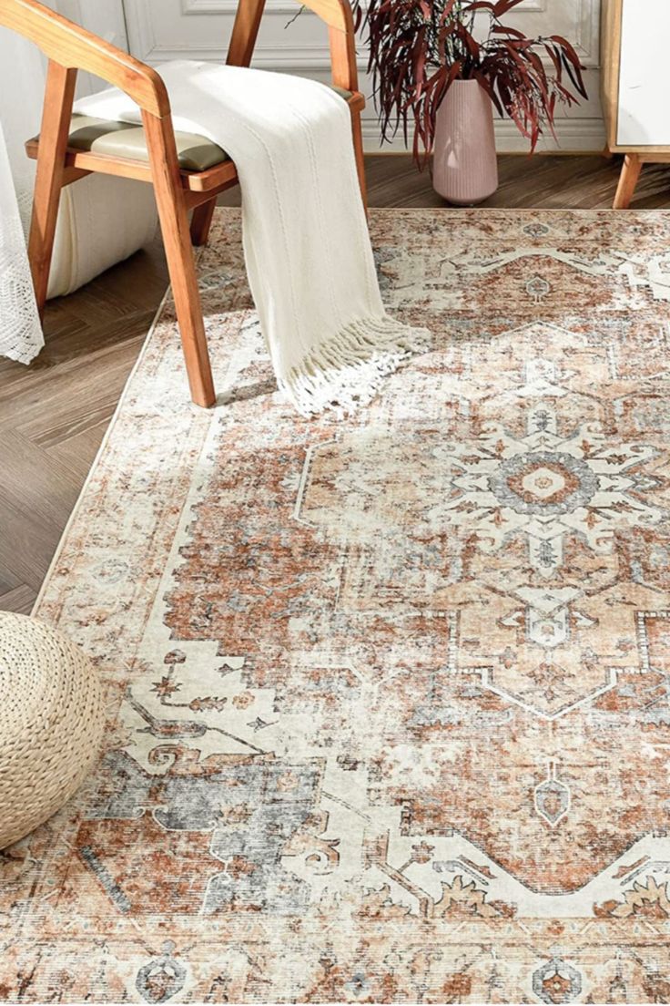 a large area rug with an ornate design on the bottom and sides in various colors