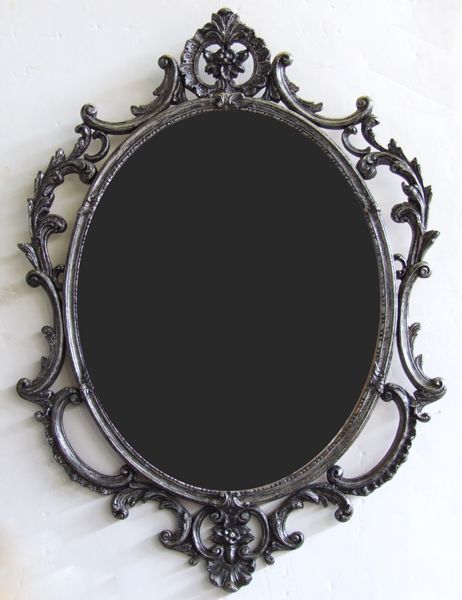 an ornate mirror hanging on the wall