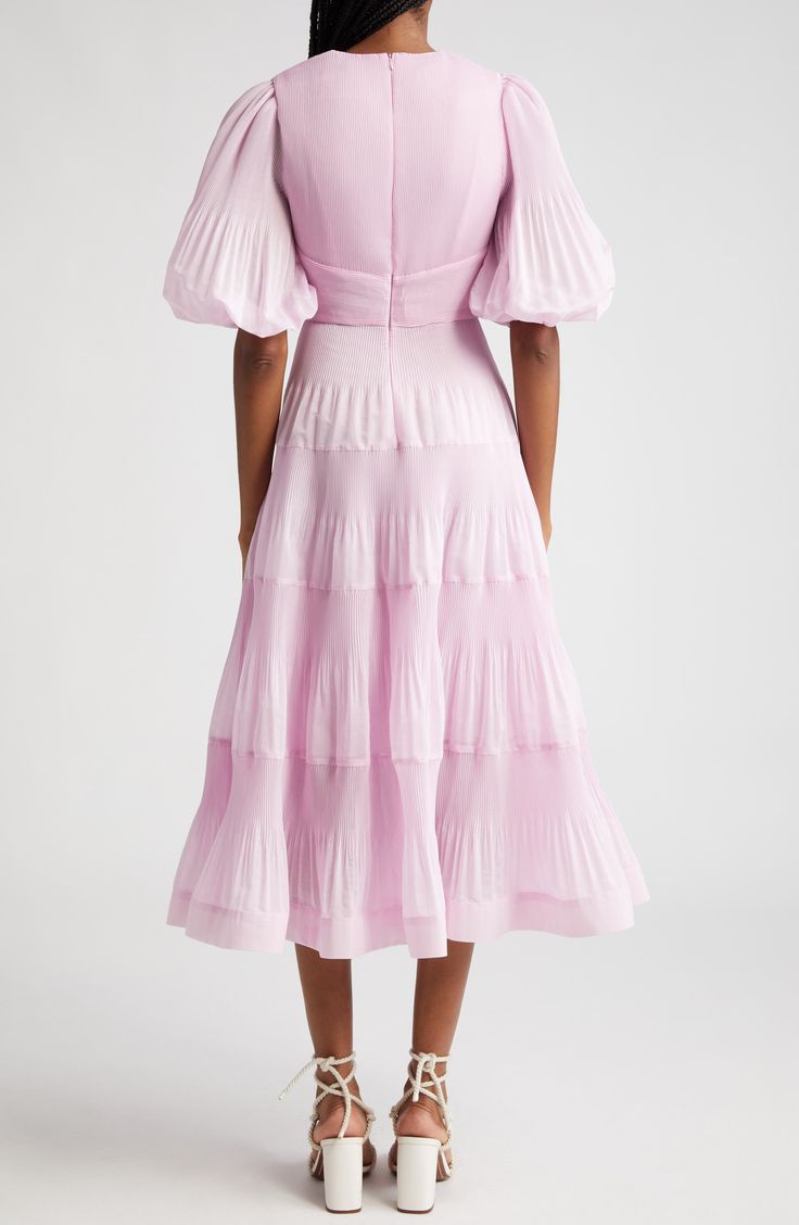 Inspired by snapshots of dance halls from the '50s, this pleated midi dress showcases voluminous sleeves and a tiered skirt lifted by a layer of crinoline. 49 1/2" length (size 8US) Hidden back-zip closure Deep V-neck with button-and-loop closure Elbow-length sleeves with elastic cuffs Lined except sleeves 100% polyester Dry clean Imported Designer Clothing Designer Clothing Brands, Voluminous Sleeves, Yellow Midi Dress, Dream Dresses, Linen Midi Dress, Tiered Midi Dress, Silk Midi Dress, Cotton Midi Dress, Pleated Midi Dress