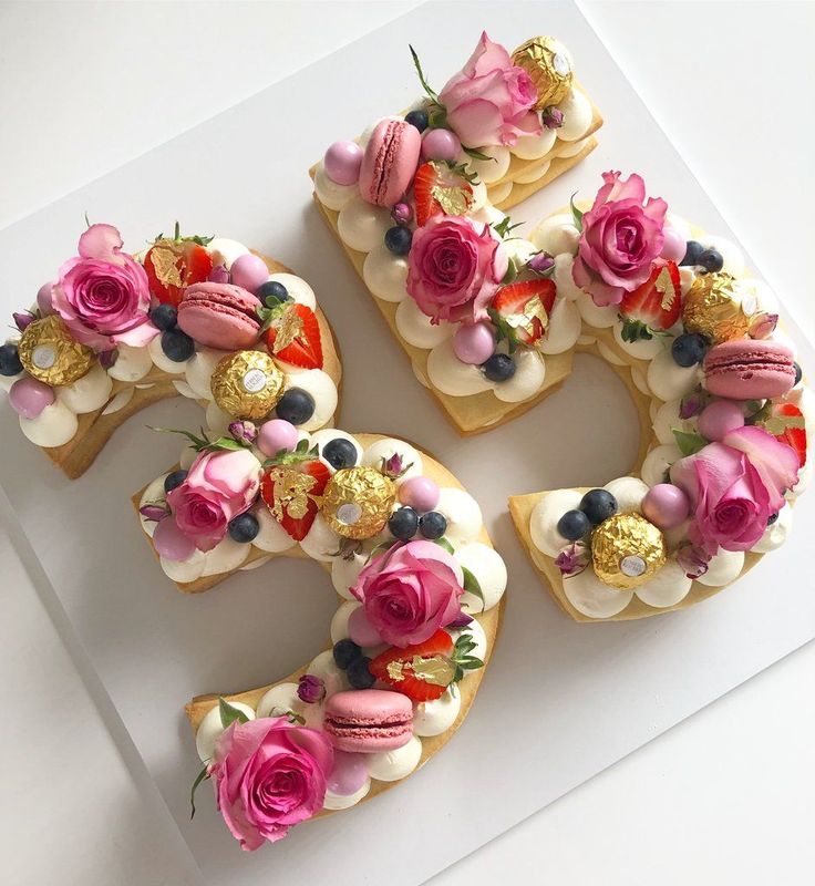 the number six is made out of cookies with frosting and flowers on them,