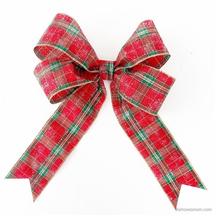 a red and green plaid bow on a white background