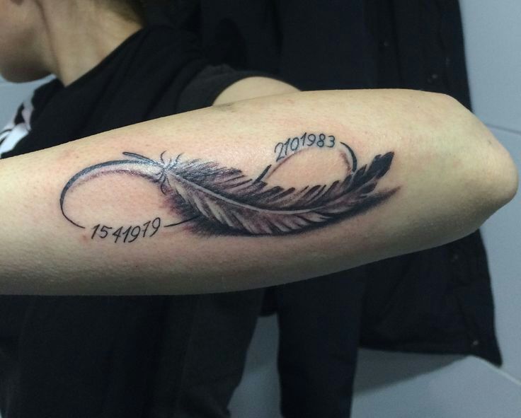 a woman with a feather tattoo on her arm and the word love is written in cursive writing