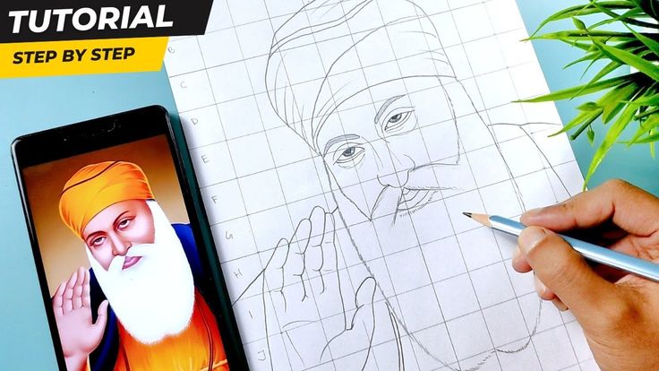 someone is drawing an image on paper with pencils and a cell phone next to it