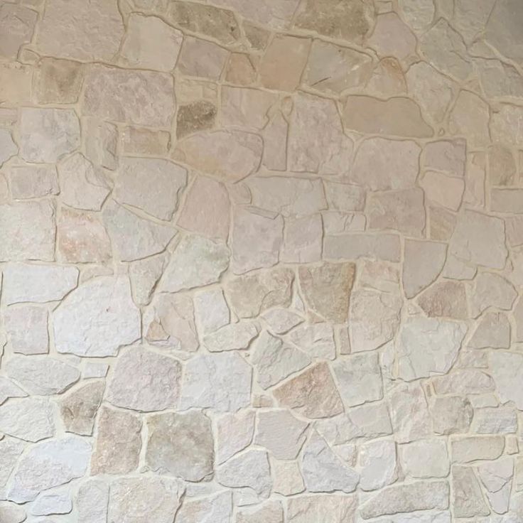 a stone wall that is made out of rocks