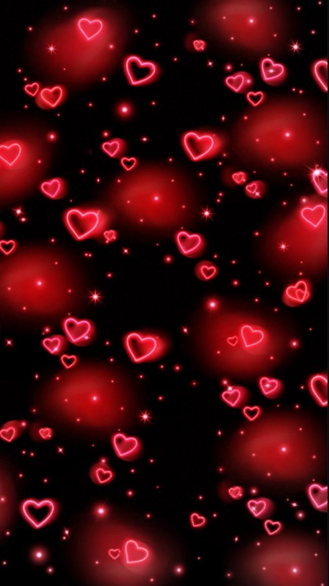 many red hearts floating in the air on a black background with stars and sparkles