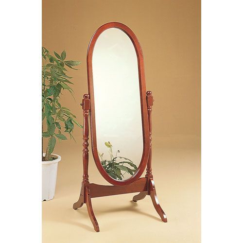 a wooden stand with a large mirror on it's top and potted plant in the background