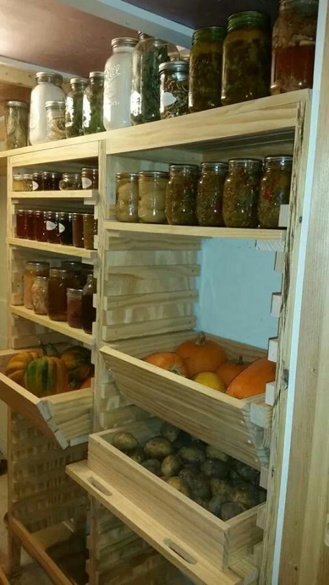 the shelves are filled with many different types of jars and food in glass containers on them