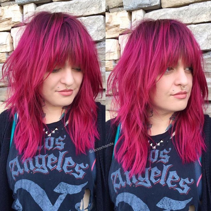 This Edgy Shag Cut with Messy Textured Fringe and Magenta Color with Shadow Roots is a great look for someone seeking a cool eccentric style. This shaggy layered cut can be worn sleek and straight, with textured waves or curls, or with a simple blowout for body and movement. The fun pink hair color and shadow roots give this cut a personal style. Styling tips for this shaggy haircut and other similar long hairstyles and hair color ideas can be found at Hairstyleology.com Hot Pink Shag Hair, Pink And Dark Pink Hair, Dark Pink Hair With Bangs, Magenta Hair Dark Roots, Pink Shaggy Hair, Pink Shag Haircut, Magenta Hair With Bangs, Pink Hair With Roots, Pink Hair Shadow Root