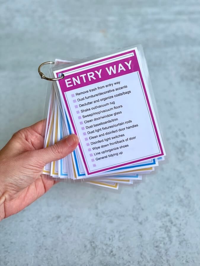 a hand holding a stack of small business cards with the words entry way on it