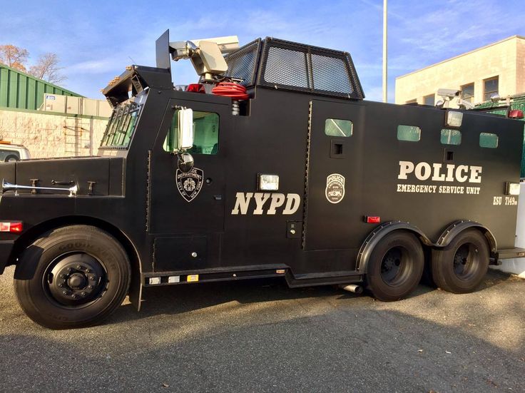 a nypd truck parked in front of a building