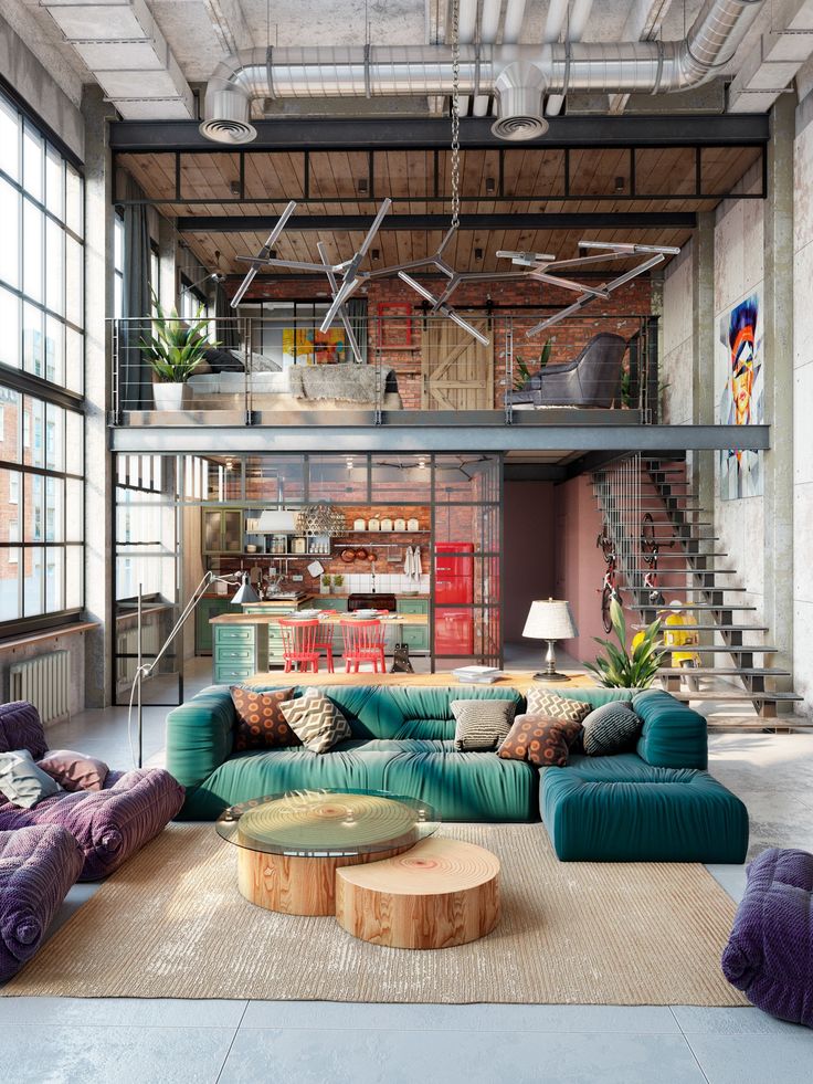 a living room filled with lots of furniture next to a fire hydrant and stairs