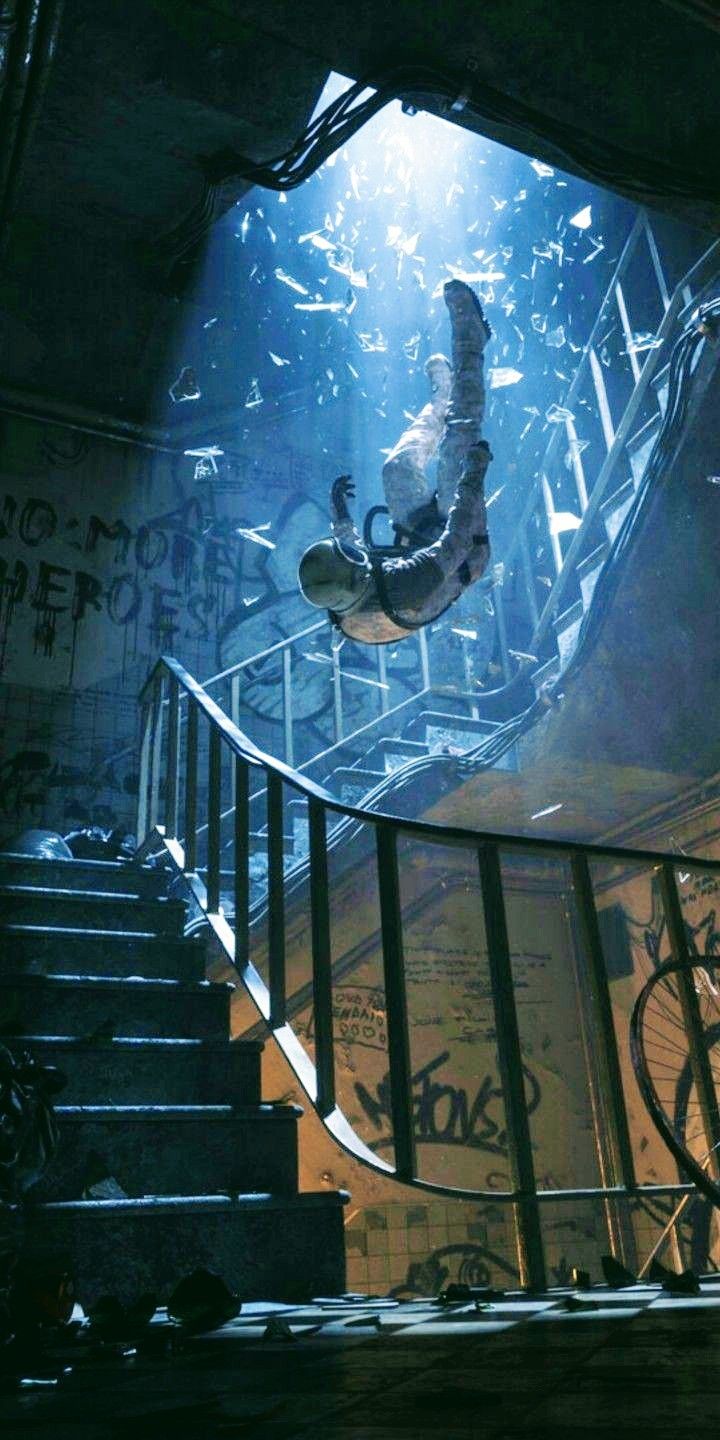 a person on a skateboard in the air above some stairs with graffiti all over them