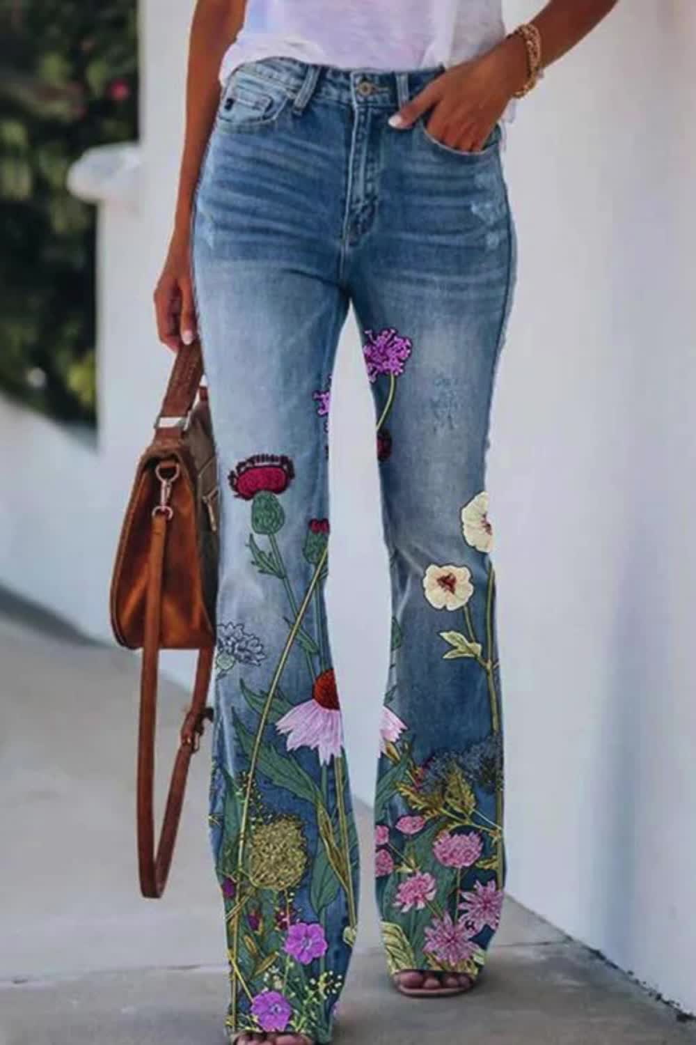 The Floral Casual Pants Jeans infuse a touch of charm into everyday wear. Adorned with a delightful floral pattern, they add a playful and feminine flair to any outfit. Crafted from comfortable denim, these jeans offer both style and ease, making them perfect for casual outings and adding a vibrant pop to your wardrobe.