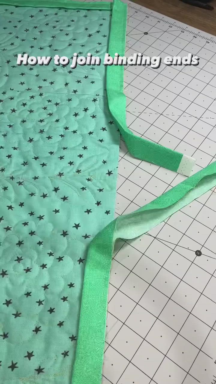 This may contain: the green fabric is being sewn together to make a star pattern on the quilt