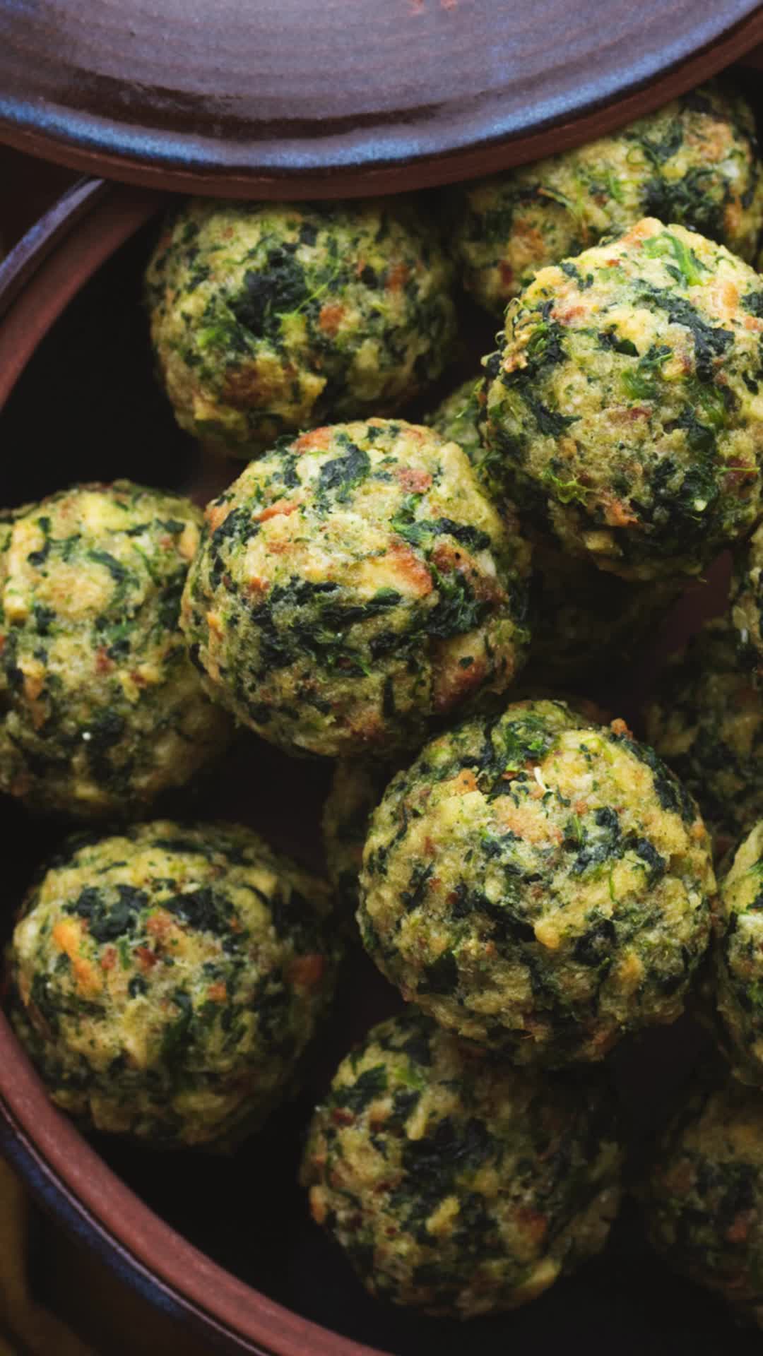 This may contain: a bowl full of spinach balls with the words how to make styrofoam