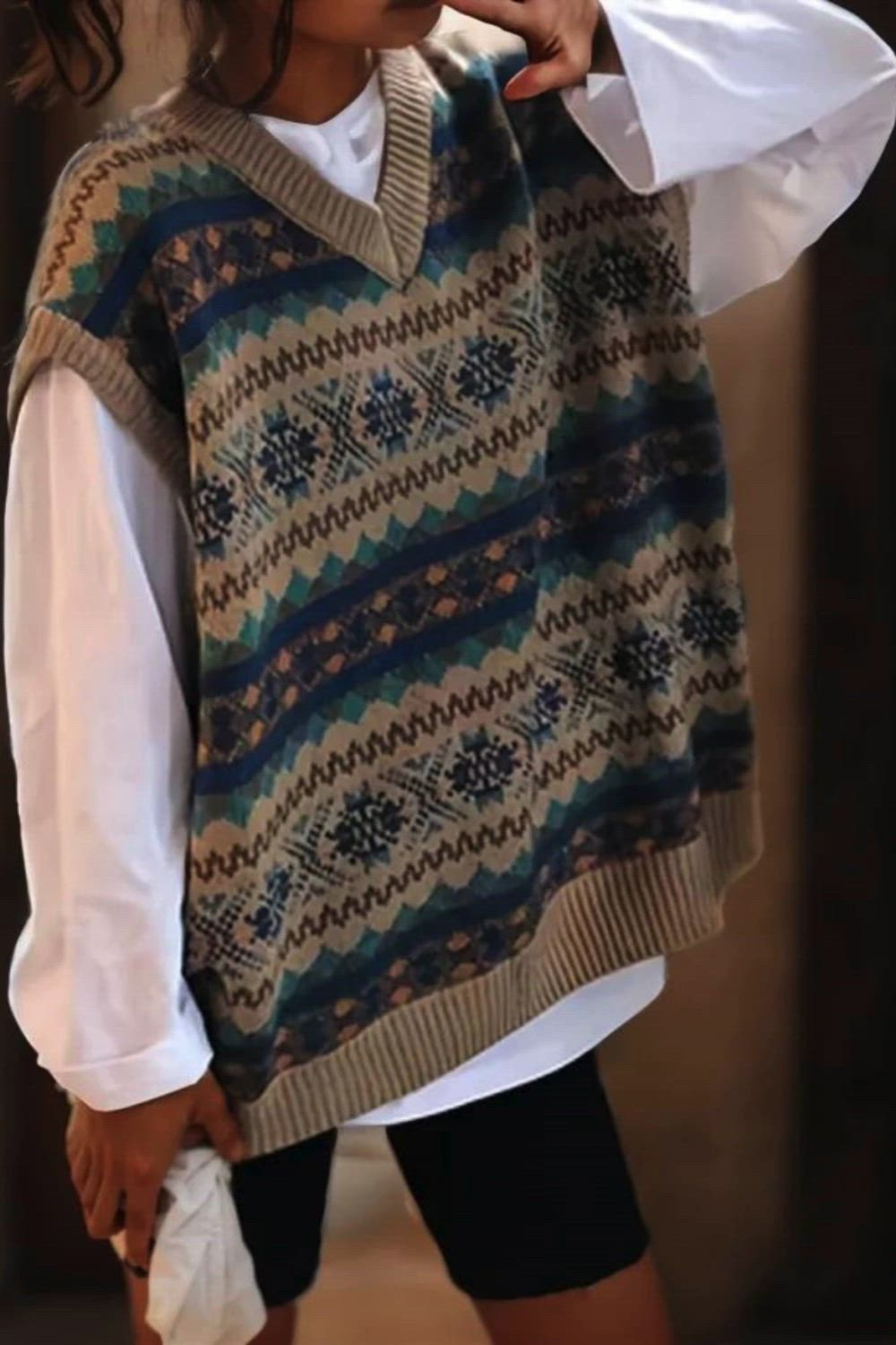 Achieve a preppy and stylish look with the Allover Pattern V Neck Sweater Vest. This sleeveless knit boasts a loose and comfortable fit, making it an ideal choice for versatile layering. The eye-catching allover pattern adds a touch of sophistication, making this sweater a perfect blend of fashion and comfort.