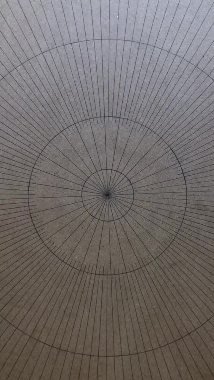 This may contain: an overhead view of a circular pattern on the floor in a public area with no people