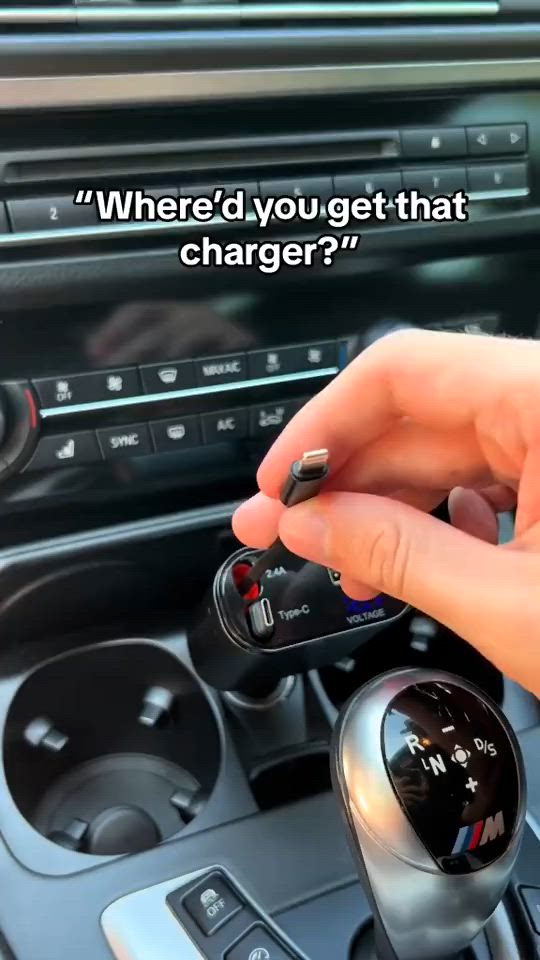 This may contain: someone is holding the car key in their hand and pressing it to change the start button