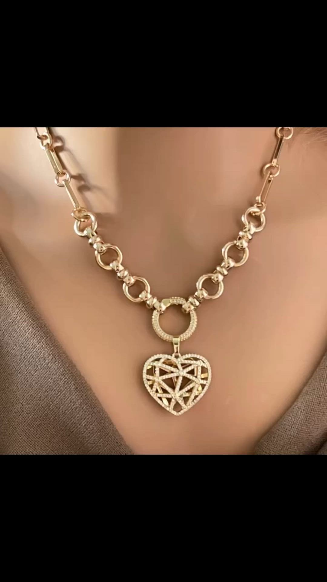 This contains an image of: Gold Multi link Heart Necklace