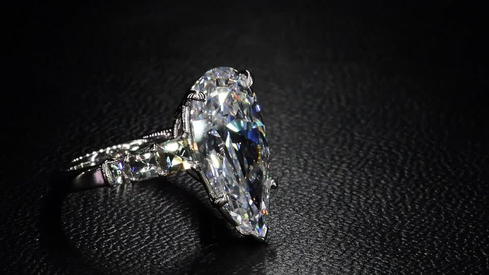 This contains an image of: A Stunning Pear Shape Diamond with Blaze® Diamond Accent by Bez Ambar