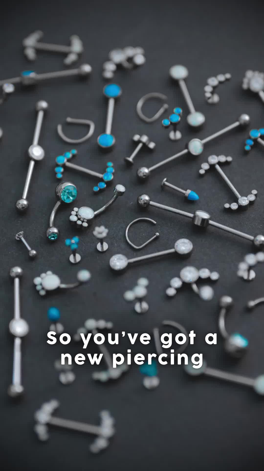 This may contain: the cover of threaded jewelry, with blue and white beads scattered around it on a black surface