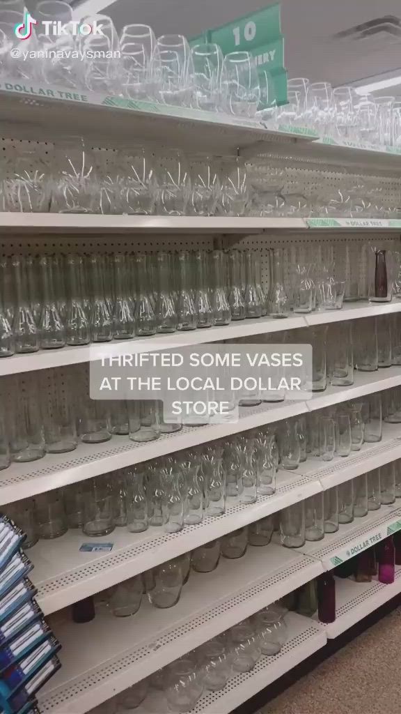 This may contain: there are many empty glasses on the shelves in this store, and one is labeled'tried some vases at the local store '