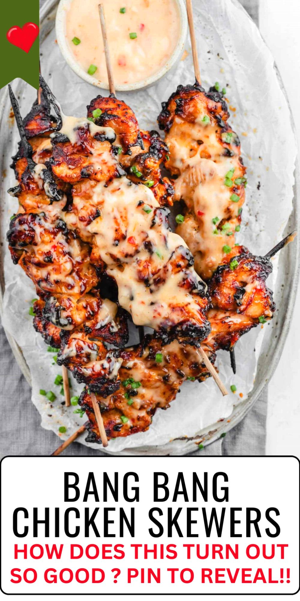 This contains: Get ready for Bang Bang Chicken Skewers! Juicy chicken with a spicy, creamy sauce, and air fried.  They pack a flavorful punch that's both sweet and spicy, sure to be a crowd-pleaser!