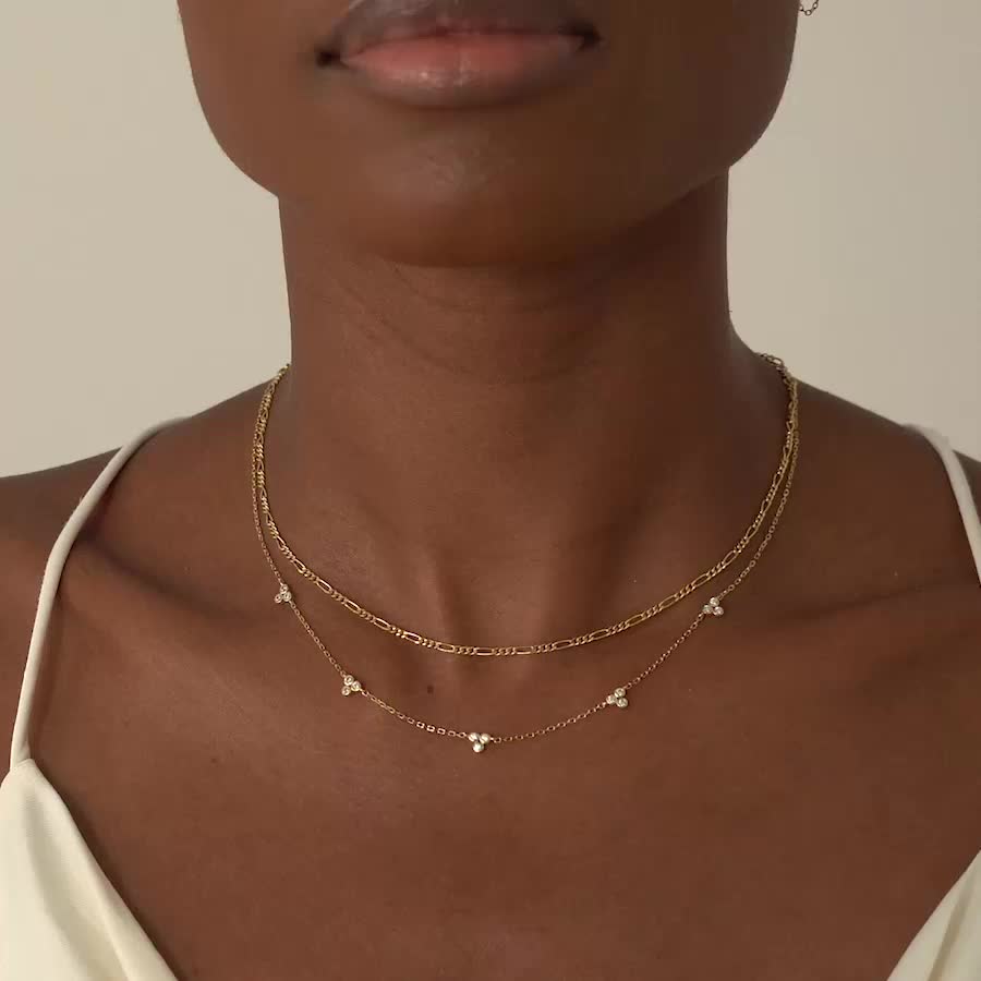 This necklace features five intricate crystals evenly spaced apart on a delicate, diamond-cut cable chain from our signature O Collection. Pair it with other necklaces from this collection. Our patented connectors let you easily link and layer necklaces in any order you desire. Cubic Zirconia with Bezel setting, 4mm Adjustable chain: 15-18in (38-46cm) When layered, chain length is: 15-21in (38-53cm) Learn more Gold Vermeil Spring clasp closure Hypoallergenic, lead and nickel free #186G