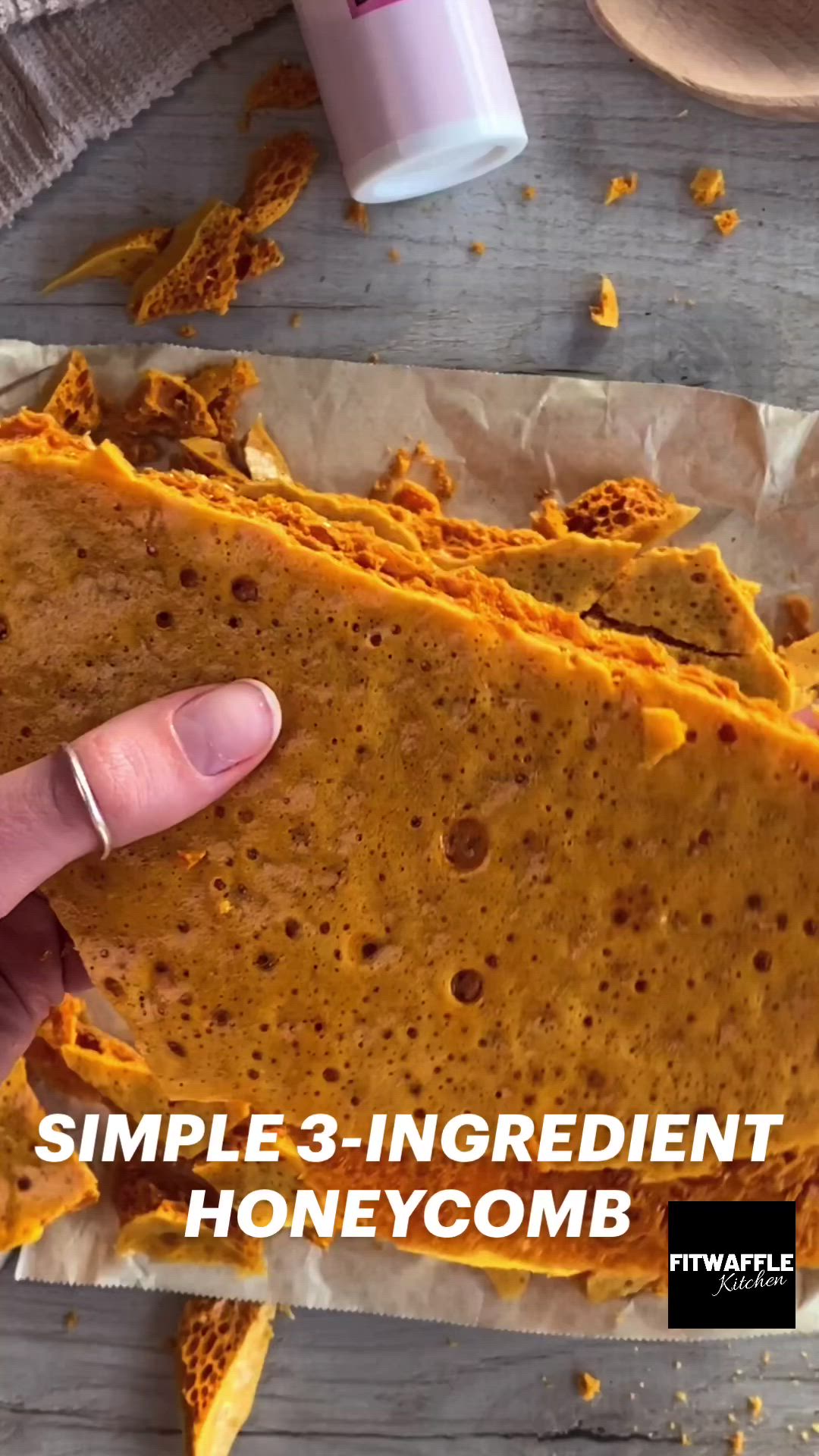 This may contain: two hands holding up a piece of bread with the words simple 3 ingredient honeycomb on it