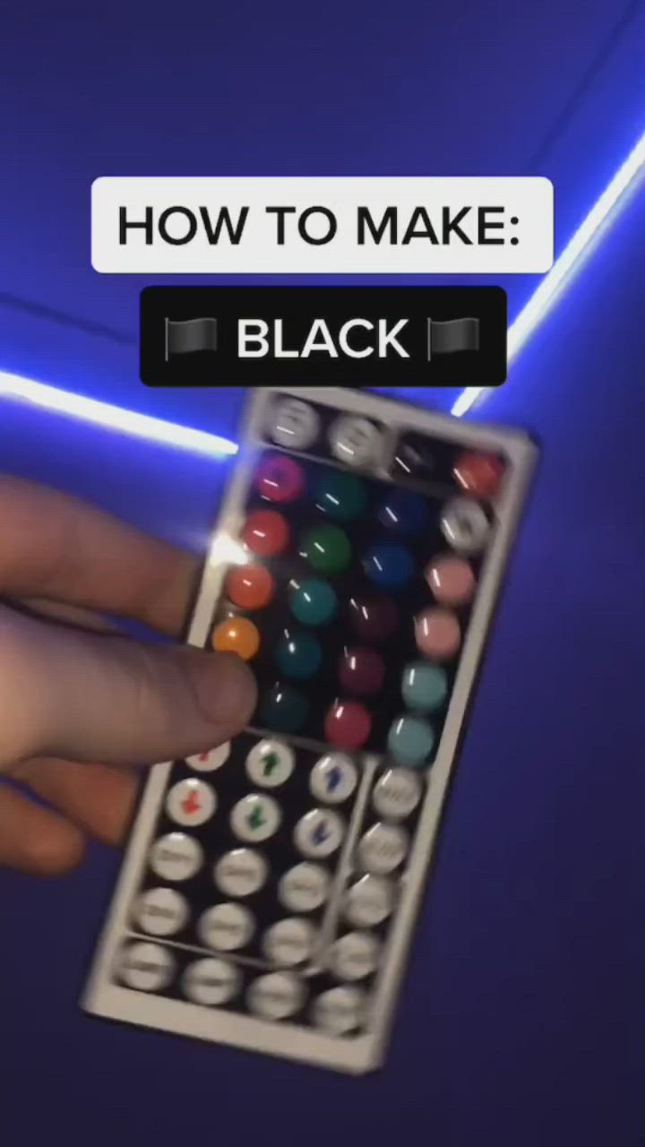 This may contain: a person holding a remote control in their hand with the words how to make black on it